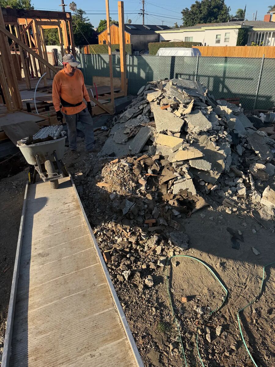 Job photo: Broken concrete and rubble cleared by wheelbarrow