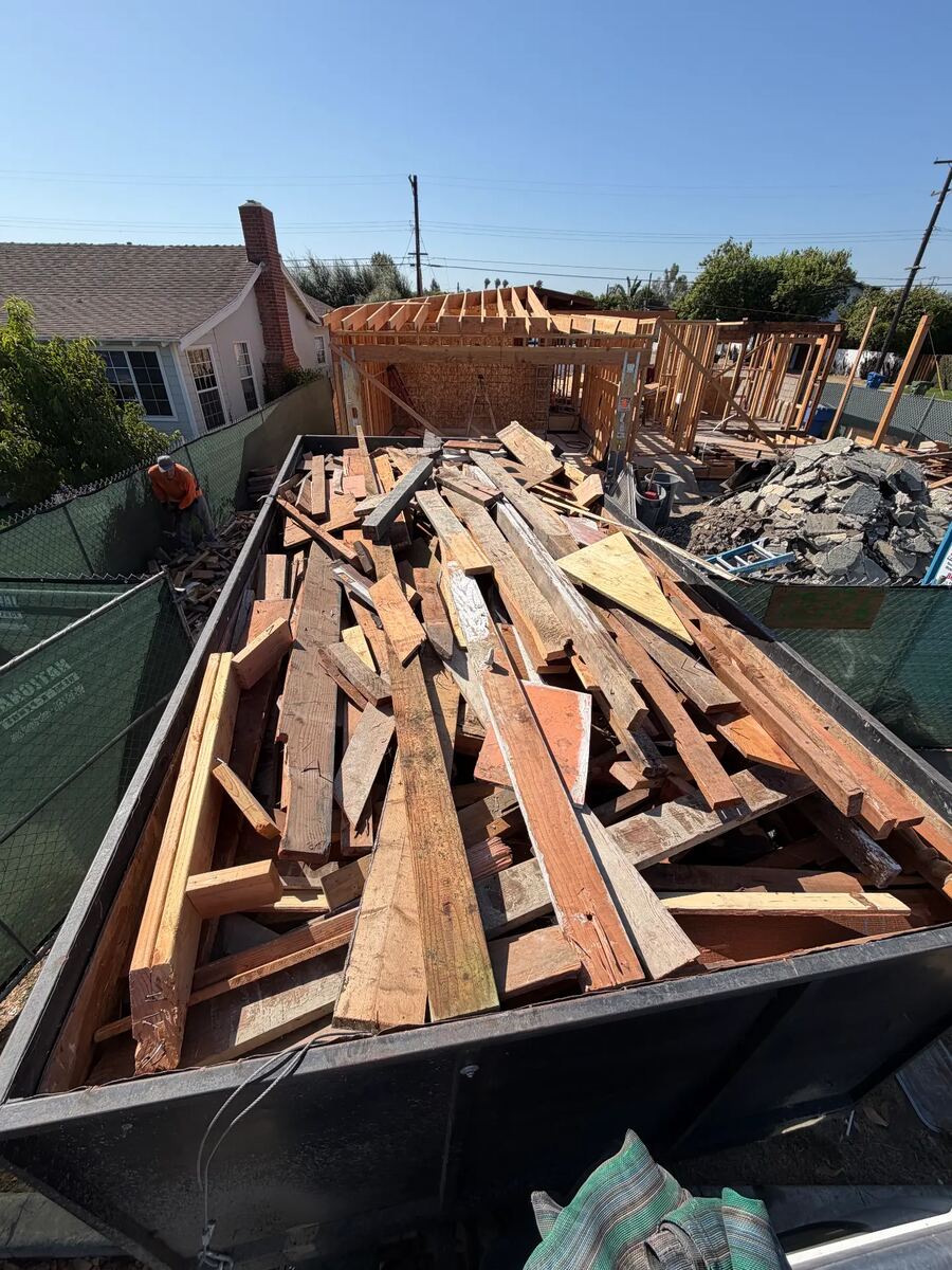 Job photo: Dump trailer packed with demolition lumber
